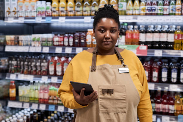 Person managing a liquor store with Rooble app